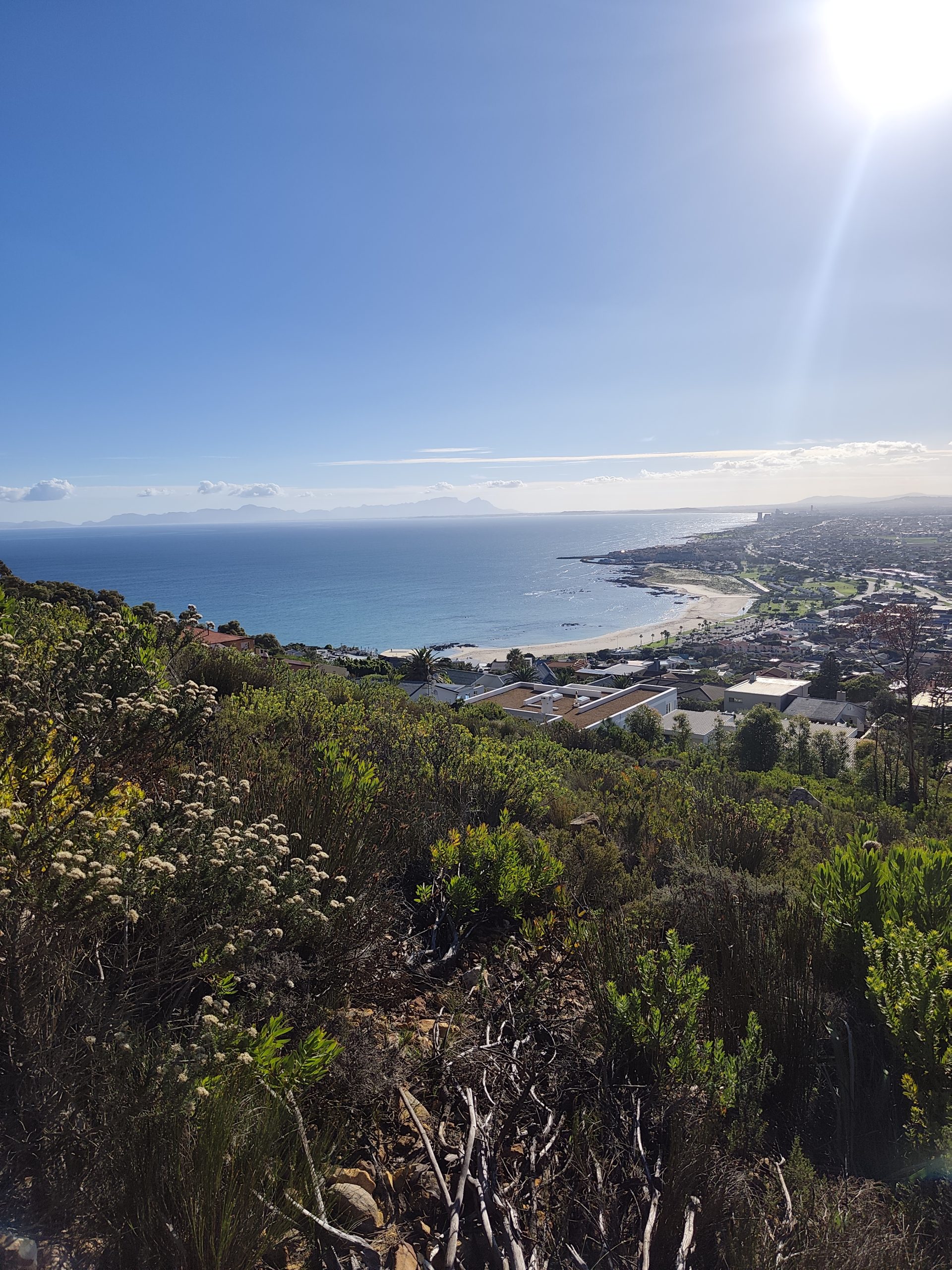 A view to distant Table Mountain across False bay and Gordon's Bay in the foreground. Taken on the Hottentots Holland Mountains