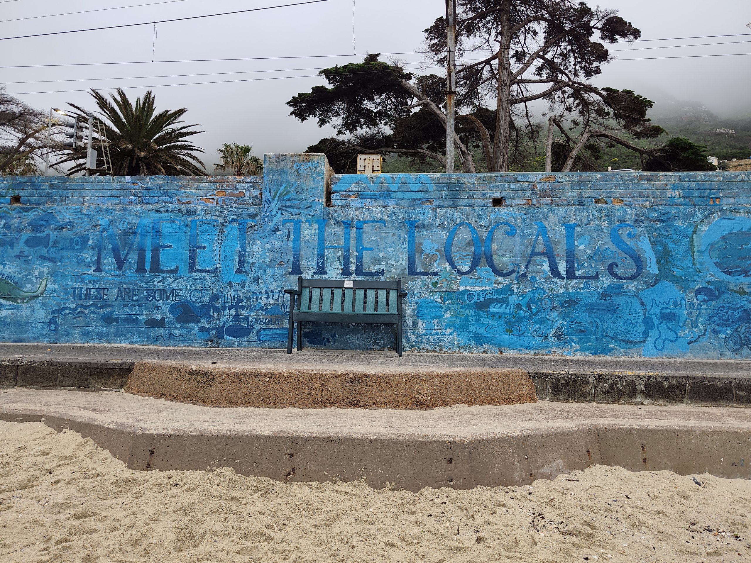 A mural at St James, Cape Town inviting people to meet the locals along the route of the Cape Peninsula Tour